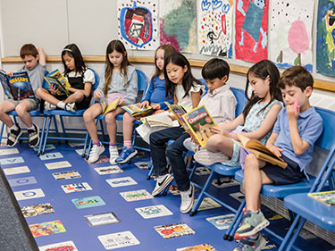 Students reading books. Links to Gifts from Retirement Plans